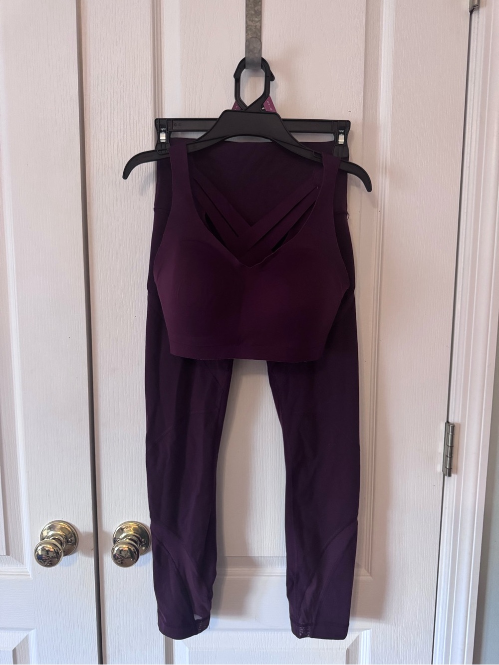 Women's Lululemon sports bra and mesh cut out leggings.